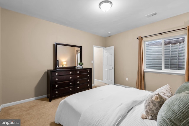 bedroom with light colored carpet