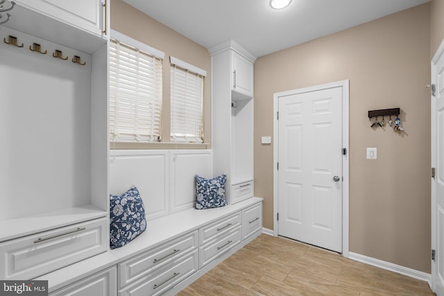 mudroom with light hardwood / wood-style flooring