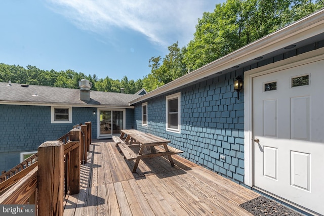 wooden deck featuring outdoor dining space