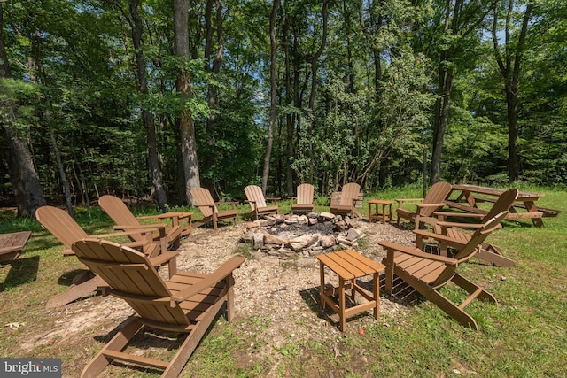 view of yard featuring an outdoor fire pit