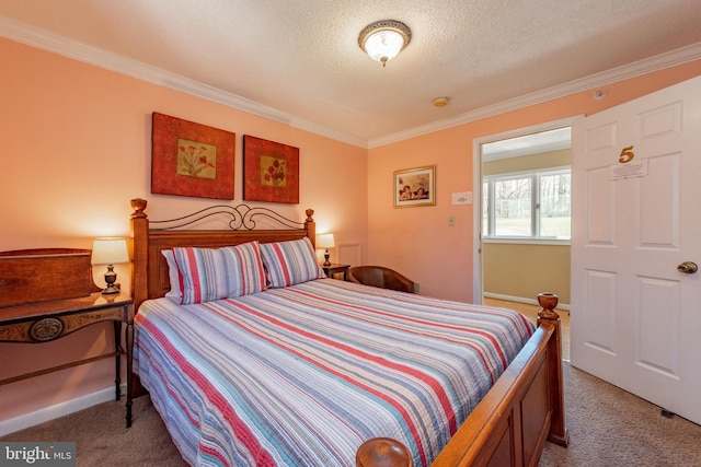 bedroom featuring carpet, ornamental molding, a textured ceiling, and baseboards