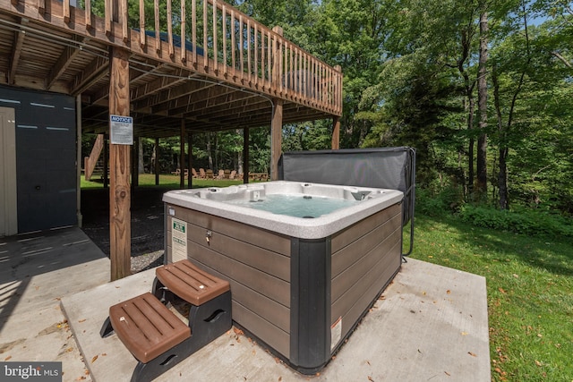 view of patio featuring a hot tub and a wooden deck