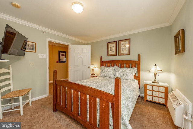 carpeted bedroom with ornamental molding and baseboards