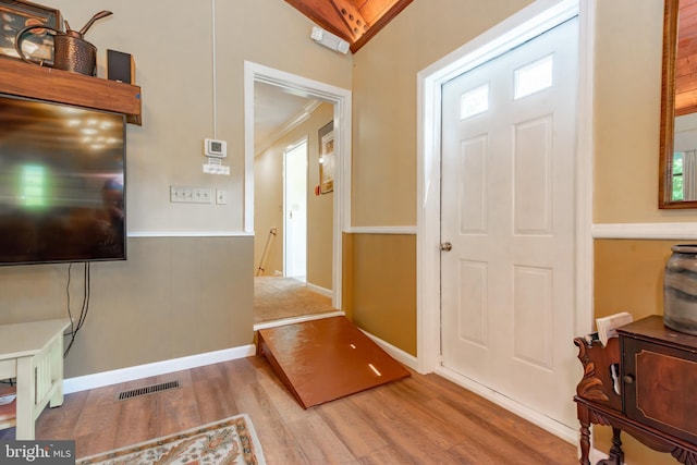 foyer featuring wood finished floors and plenty of natural light