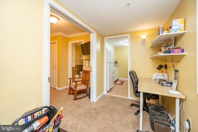 office space featuring light carpet and baseboards
