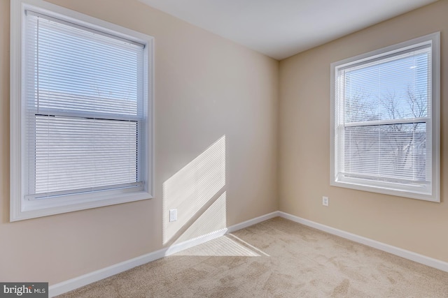 empty room featuring light carpet