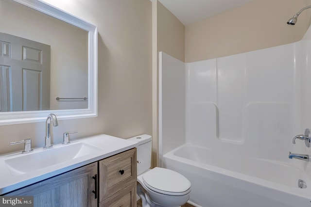 full bathroom featuring vanity, tub / shower combination, and toilet