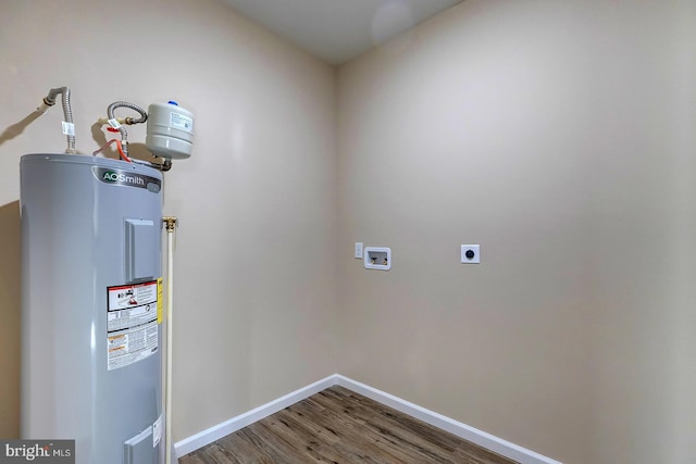 utility room featuring electric water heater