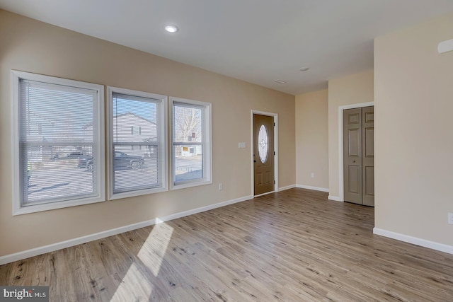 entrance foyer featuring a healthy amount of sunlight and light hardwood / wood-style flooring