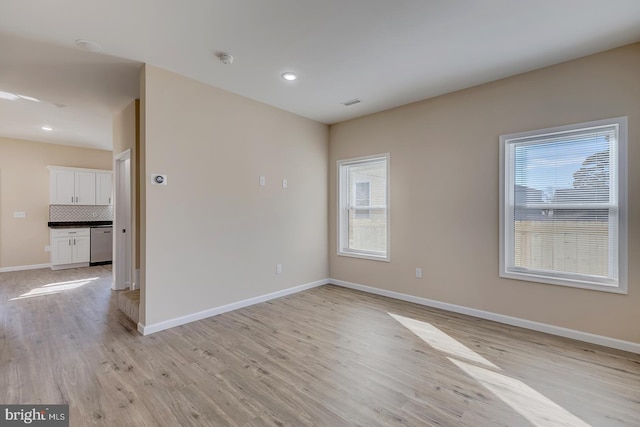 unfurnished room featuring light hardwood / wood-style flooring