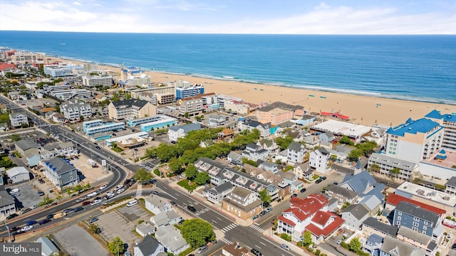 bird's eye view featuring a view of the beach and a water view