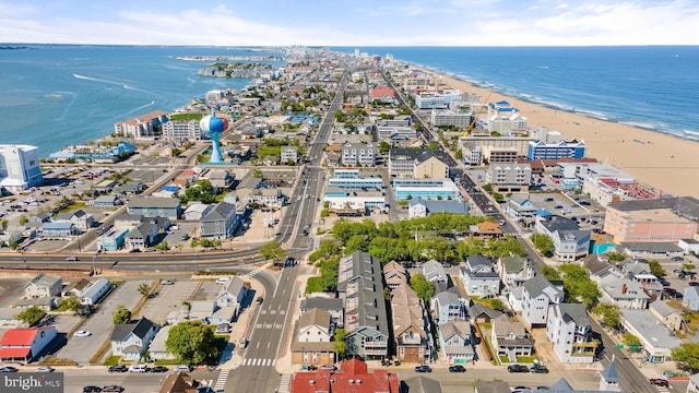 bird's eye view featuring a water view and a view of the beach