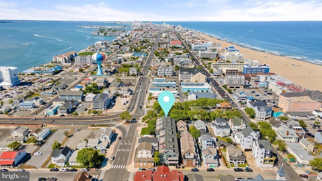 bird's eye view featuring a water view and a view of the beach