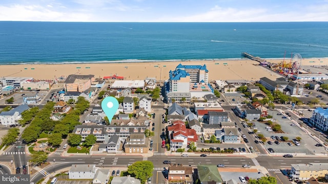 aerial view with a water view and a view of the beach