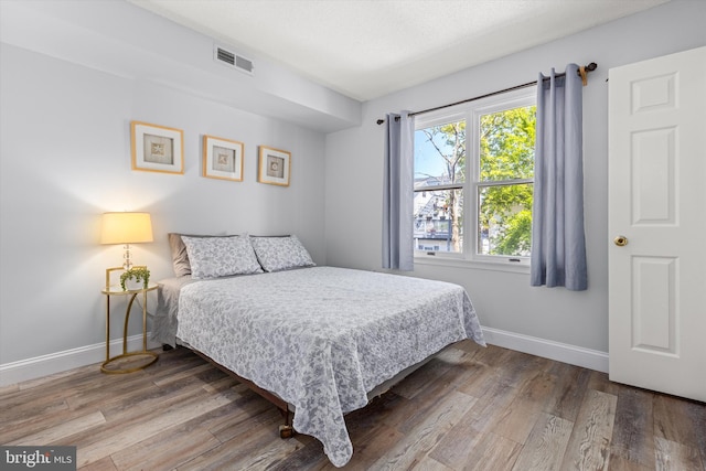 bedroom featuring wood-type flooring