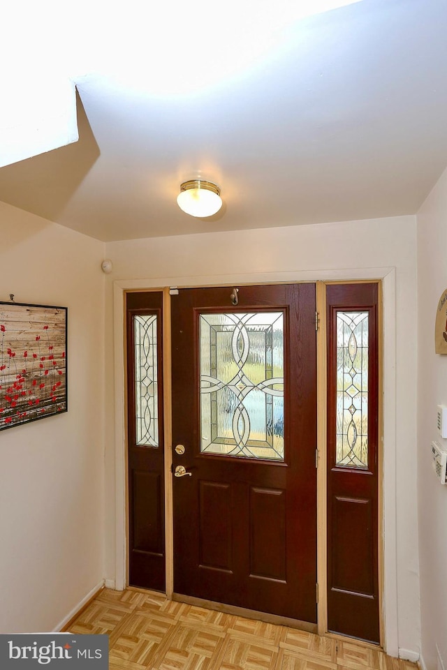 foyer entrance featuring light parquet flooring