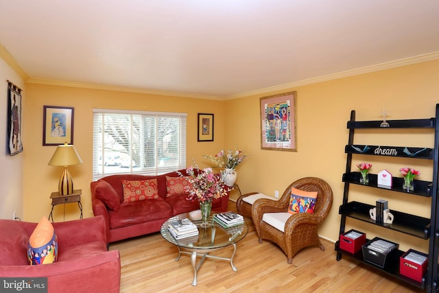 living room with light hardwood / wood-style flooring and ornamental molding