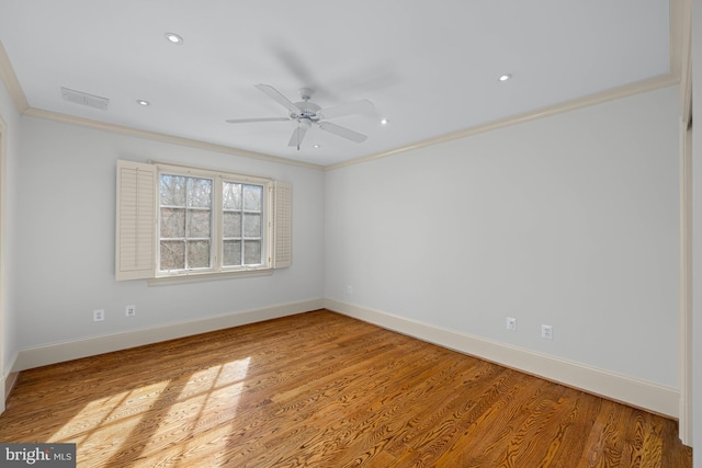 empty room featuring crown molding, ceiling fan, and light hardwood / wood-style floors