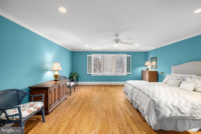 bedroom featuring crown molding, ceiling fan, and light wood-type flooring