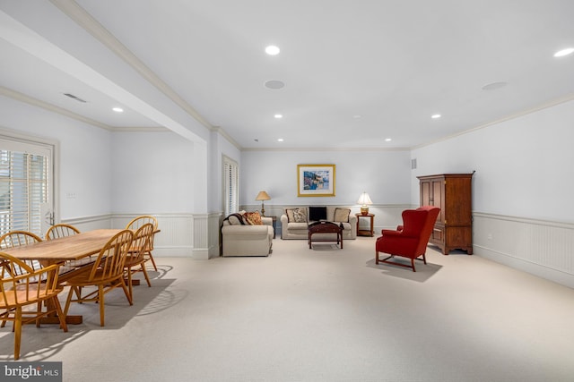 living room featuring ornamental molding and light colored carpet