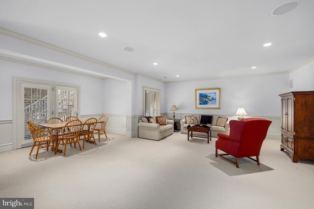 carpeted living room with ornamental molding