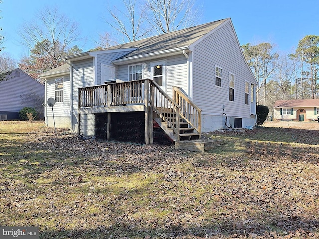 rear view of property featuring central AC and a deck