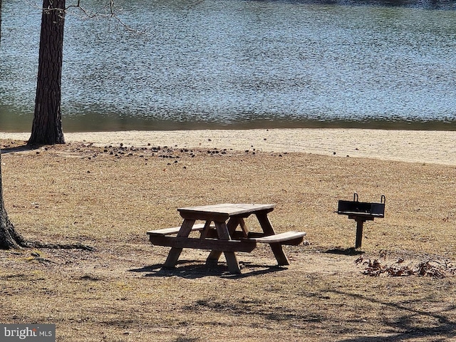 view of community with a water view