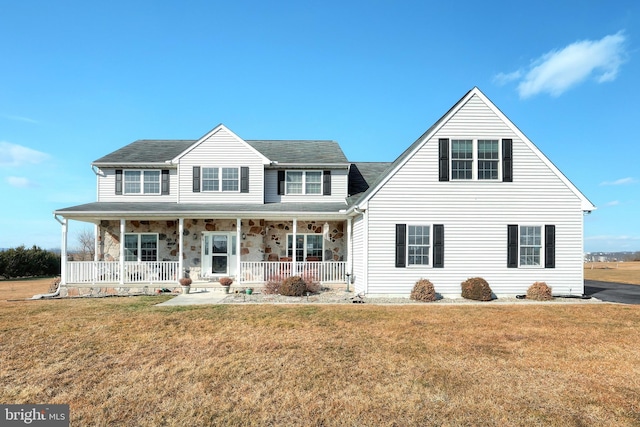 view of front of home featuring a front lawn and covered porch