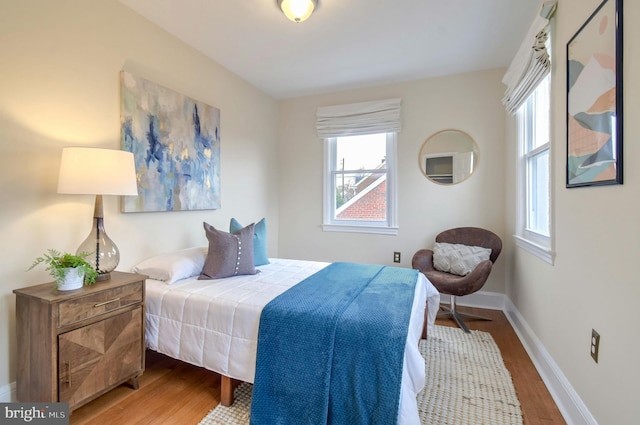 bedroom featuring wood-type flooring