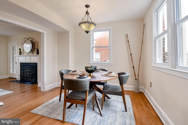 dining space featuring light wood-type flooring