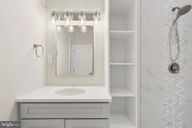 bathroom featuring walk in shower and vanity