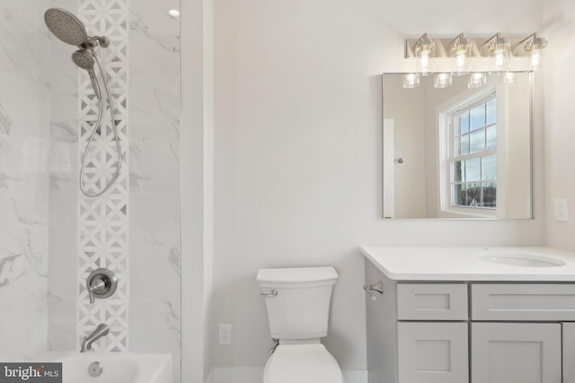 full bathroom featuring toilet, washtub / shower combination, and vanity