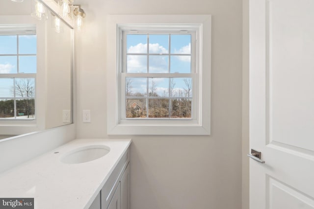 bathroom featuring a healthy amount of sunlight and vanity