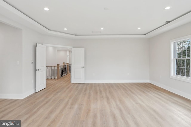 unfurnished room with light wood-style floors, baseboards, and recessed lighting