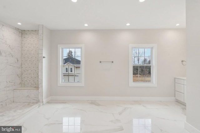 full bath with baseboards, marble finish floor, plenty of natural light, and recessed lighting