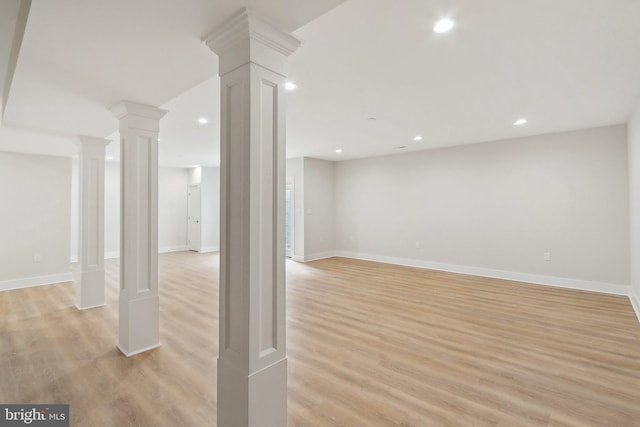 below grade area with light wood-style floors, recessed lighting, and baseboards