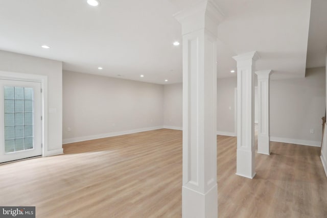 below grade area with light wood-style floors, recessed lighting, and baseboards