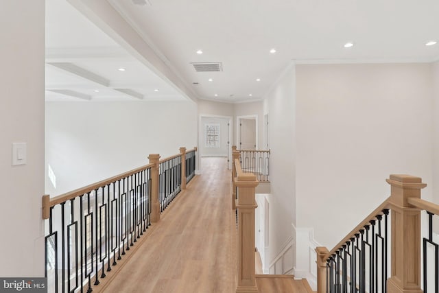 corridor featuring beam ceiling, recessed lighting, visible vents, light wood-style floors, and an upstairs landing