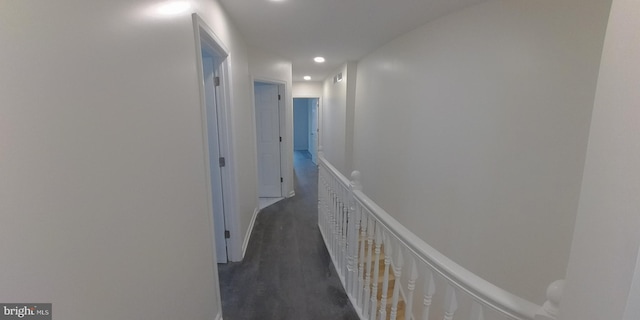 corridor featuring dark hardwood / wood-style floors