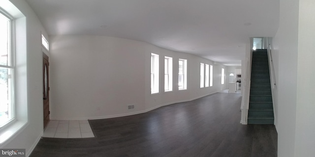 unfurnished room featuring dark wood-type flooring