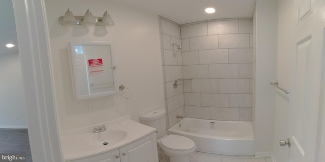 full bathroom with vanity, toilet, and tiled shower / bath combo