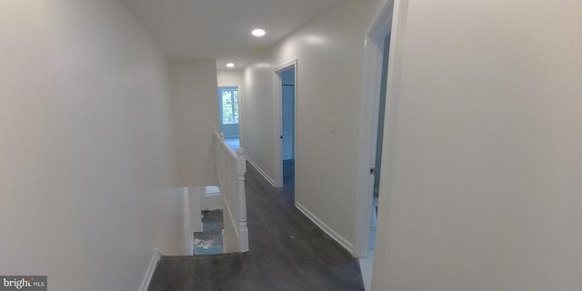 corridor featuring dark hardwood / wood-style flooring