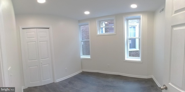 spare room with dark wood-type flooring