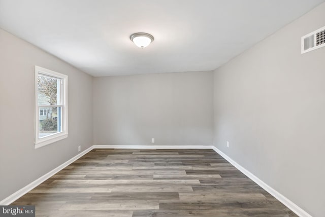 spare room featuring hardwood / wood-style flooring