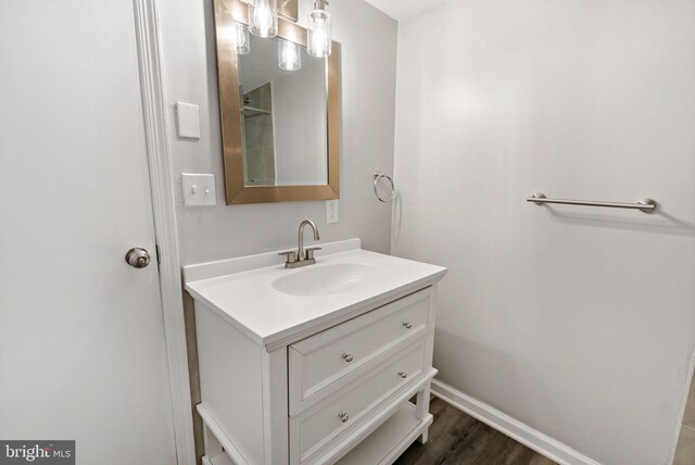 bathroom featuring vanity and hardwood / wood-style floors