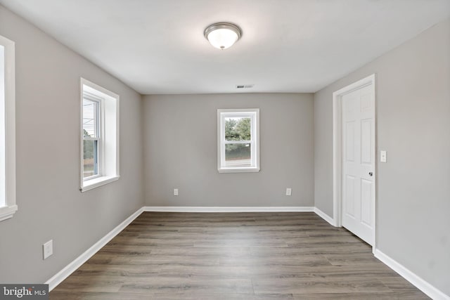 spare room featuring dark hardwood / wood-style floors