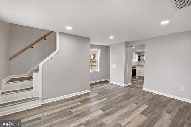 unfurnished living room with hardwood / wood-style floors