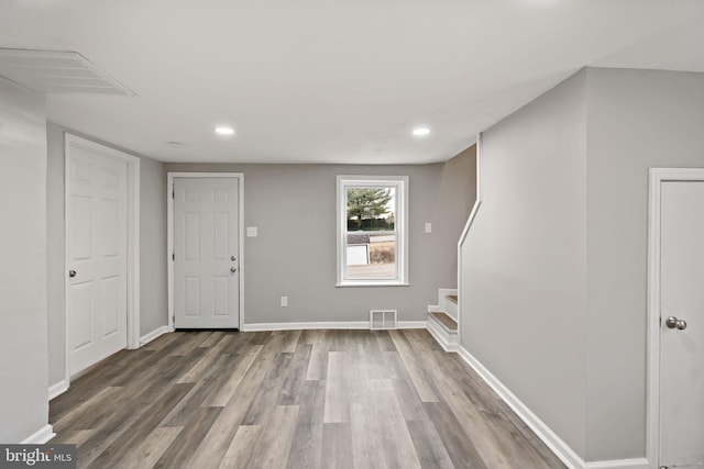 foyer entrance with hardwood / wood-style floors