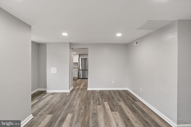 spare room featuring hardwood / wood-style floors