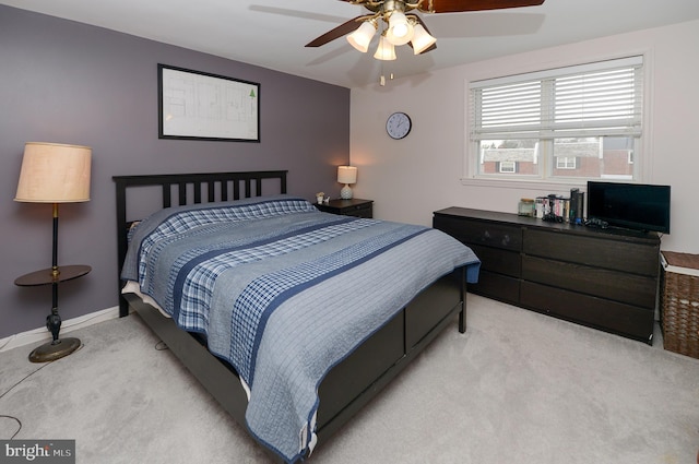 bedroom with ceiling fan and light colored carpet